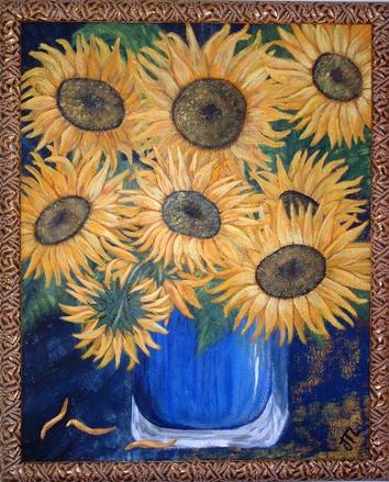 Sunflowers in blue glass vase